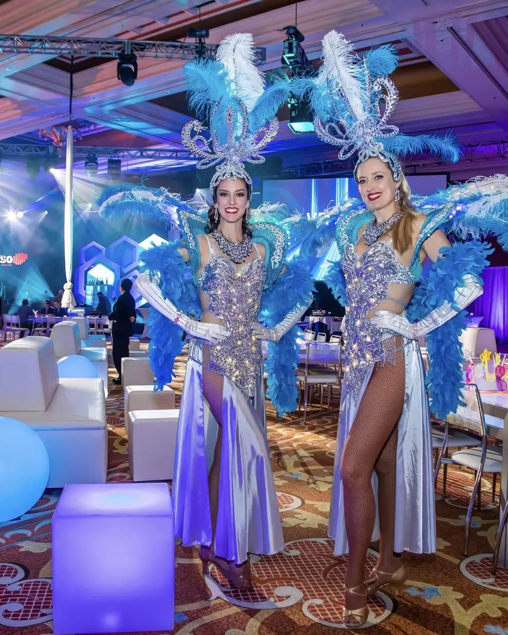 Las Vegas showgirls in feathered costumes for event entertainment